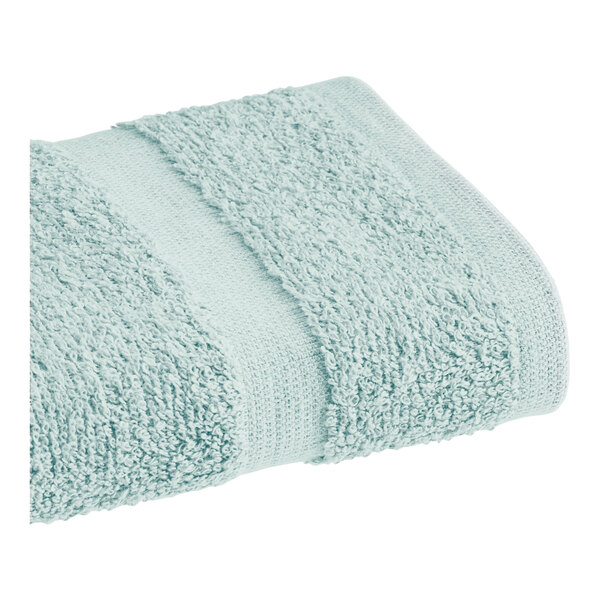A seafoam green 1888 Mills Fibertone hand towel.