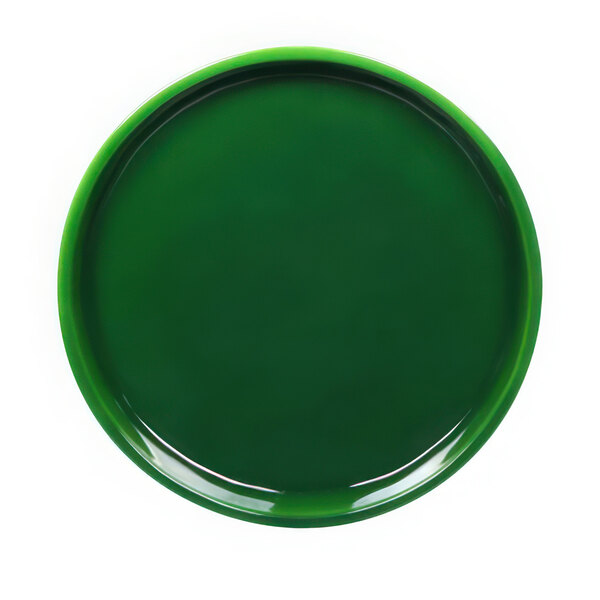 A close up of a green Elite Global Solutions Maya melamine plate with a white reactive glaze in the middle.