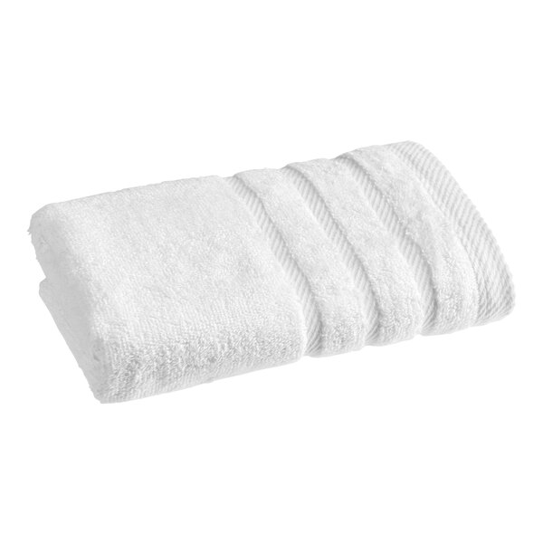 A white 1888 Mills Pure Terry hand towel folded on a white background.