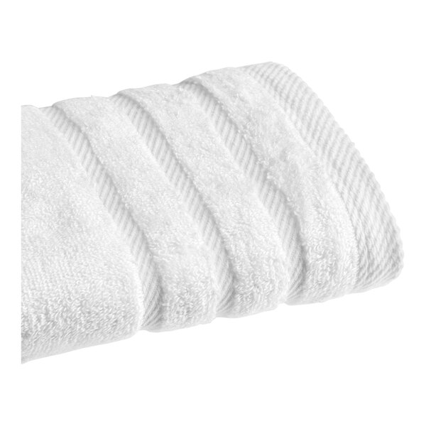 A folded white 1888 Mills Pure Terry hand towel.