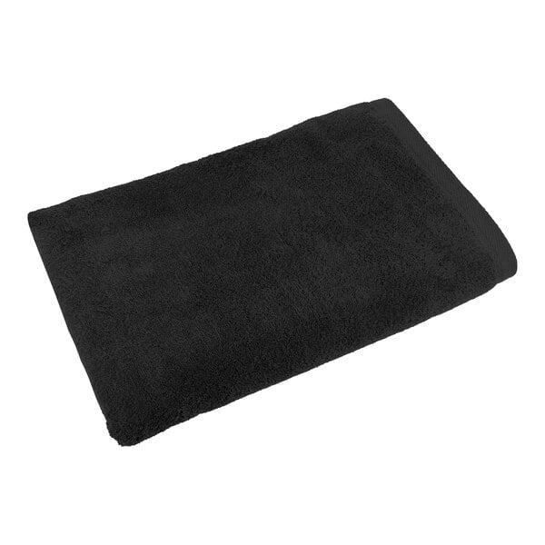 A black 1888 Mills Millennium bath towel.