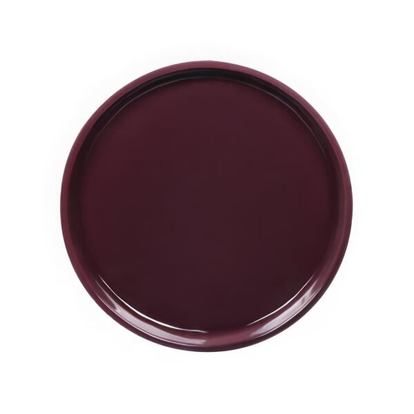 A close up of a dark purple Elite Global Solutions Maya coupe melamine plate with a rim.