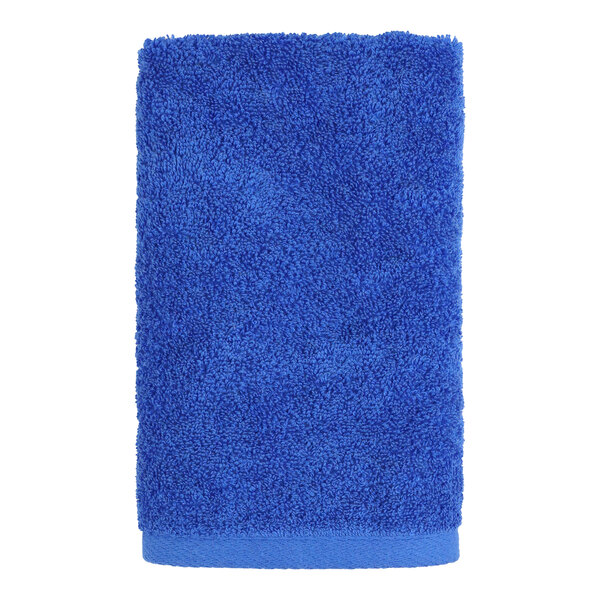 A blue 1888 Mills hand towel on a white background.