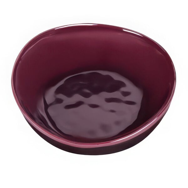 A white melamine bowl with dark purple and red reactive glaze on the rim.