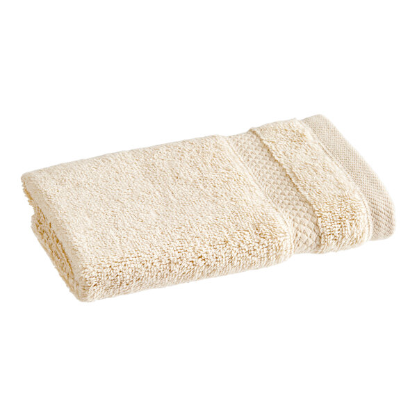 A close-up of a white 1888 Mills Magnificence Pima cotton washcloth.
