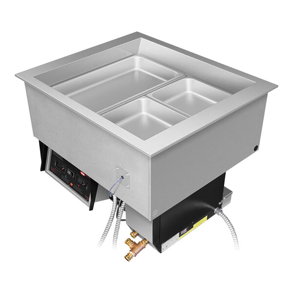 A Hatco drop-in food well with two pans inside.