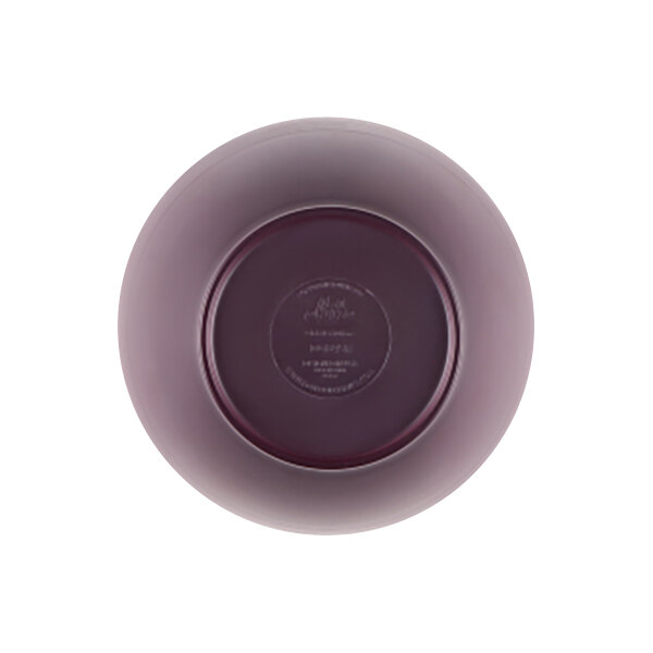 A purple glass bowl with a round bottom.