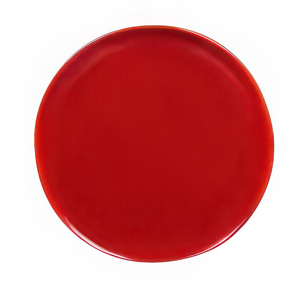 A red plate with a reactive glaze finish on a white background.