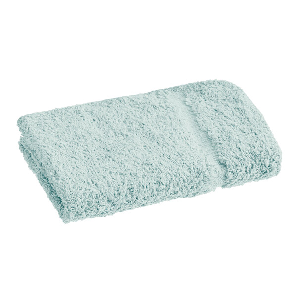 A close-up of a seafoam green 1888 Mills Fibertone washcloth.