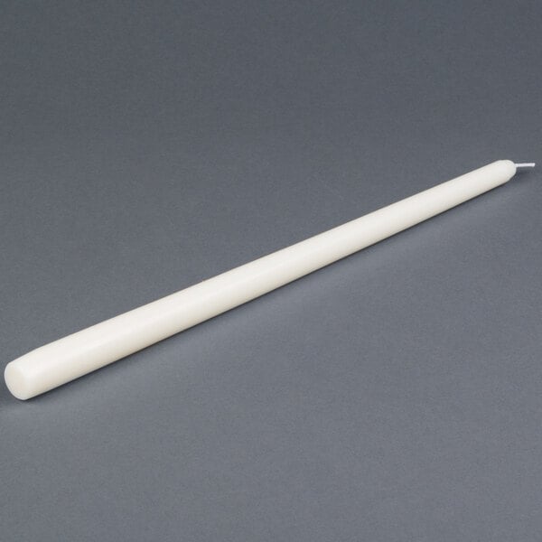 A 15 inch ivory Will & Baumer taper candle.
