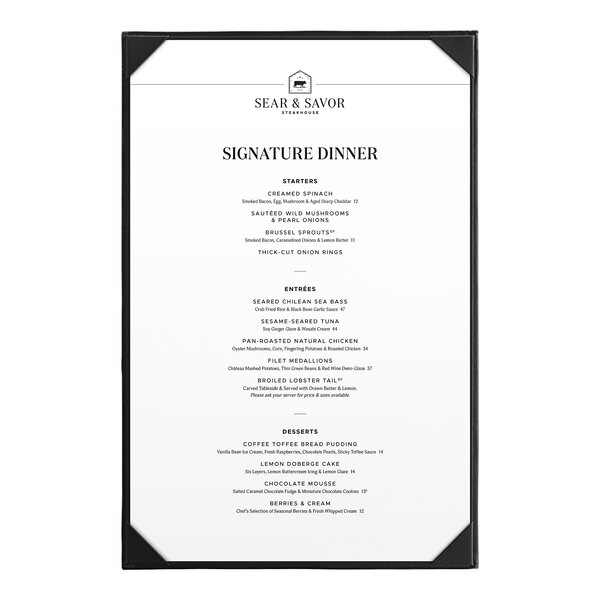 A black Acopa Prime vinyl menu board with white borders on a table in a farm-to-table restaurant.