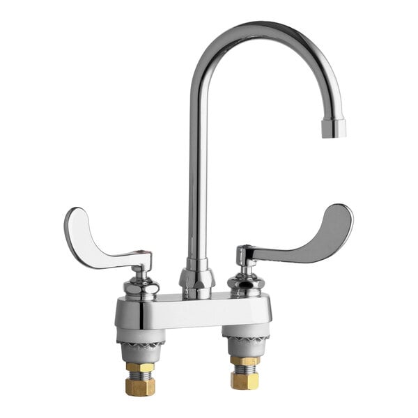 A silver Chicago Faucets deck-mounted faucet with two wristblade handles.