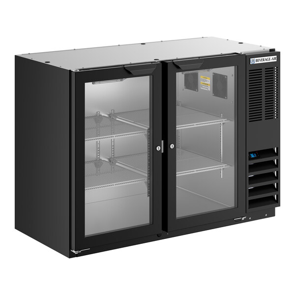 A black underbar height back bar refrigerator with two glass doors and interior shelving.