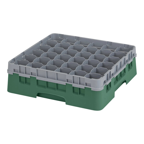 A green plastic Cambro glass rack with several compartments.