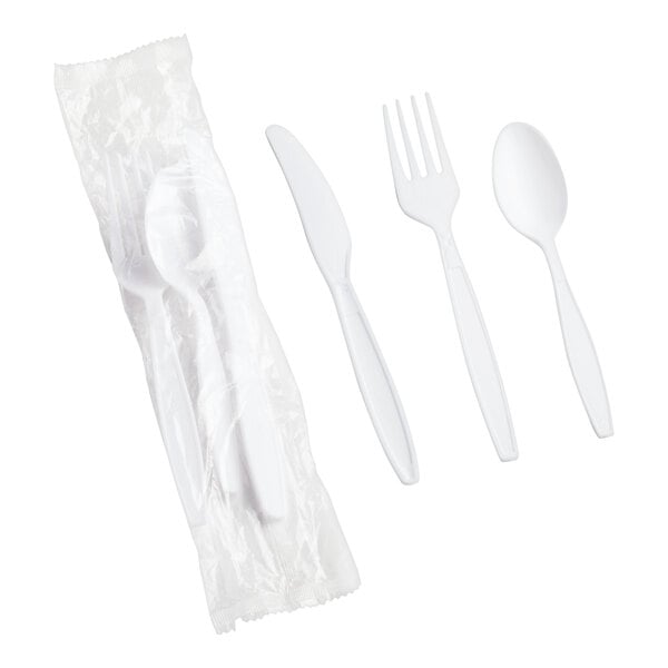 A white plastic fork, spoon, and knife set in a white plastic bag.