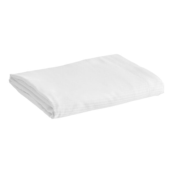 A white folded 1888 Mills Magnificence flat sheet with tone on tone stripes.