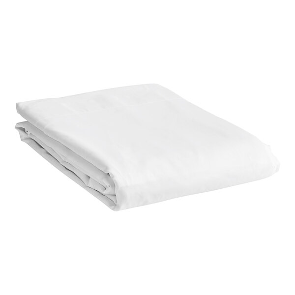 A folded white bed sheet.