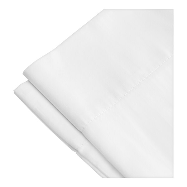 A close-up of a folded white 1888 Mills Oasis pillowcase