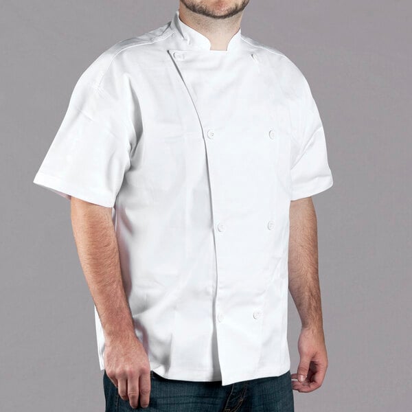 A man wearing a white Chef Revival chef jacket.