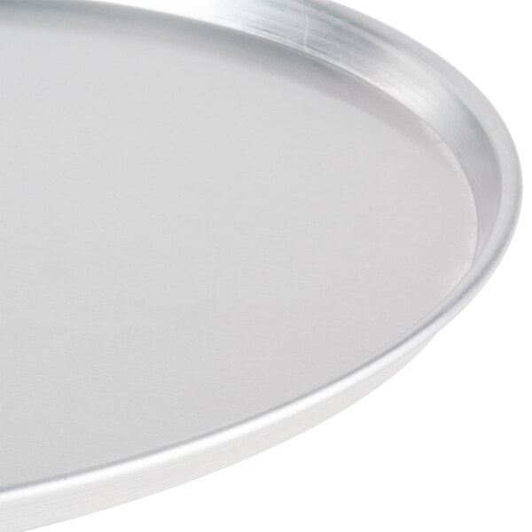 An American Metalcraft standard weight aluminum pizza pan with a white background.