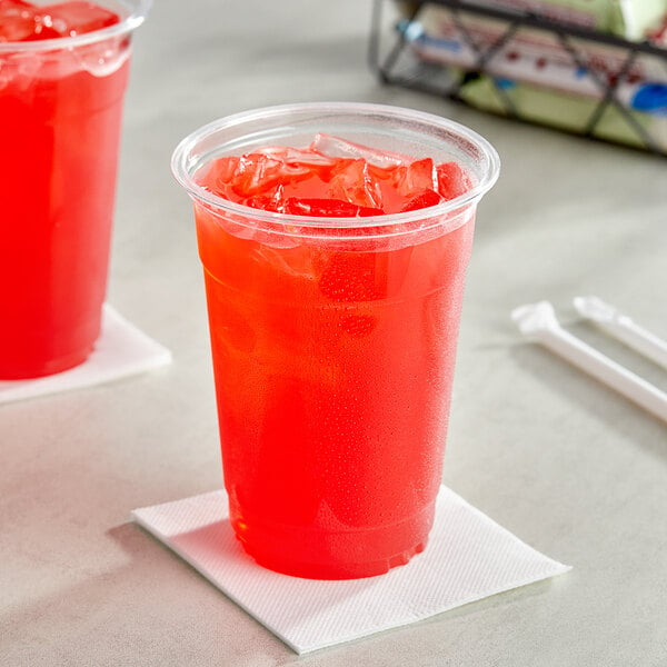 Two plastic cups filled with Gatorade Fruit Punch from a bag in box with straws.