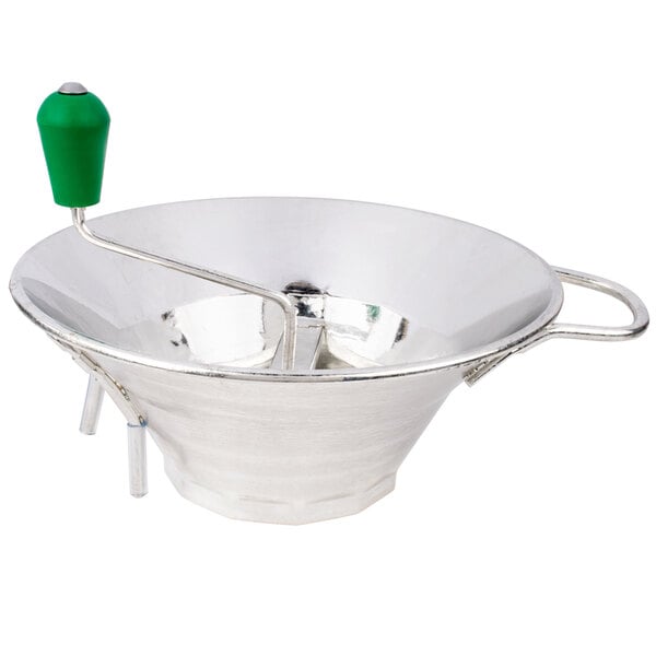 A silver bowl with a green handle.