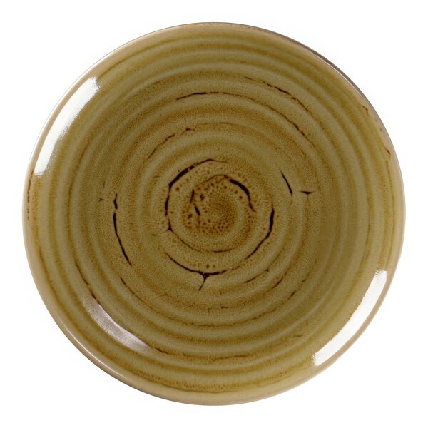 A close-up of a RAK Porcelain garnet plate with a spiral pattern.