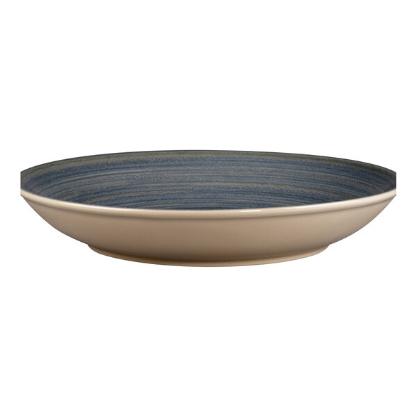 A white porcelain deep coupe plate with a blue rim.