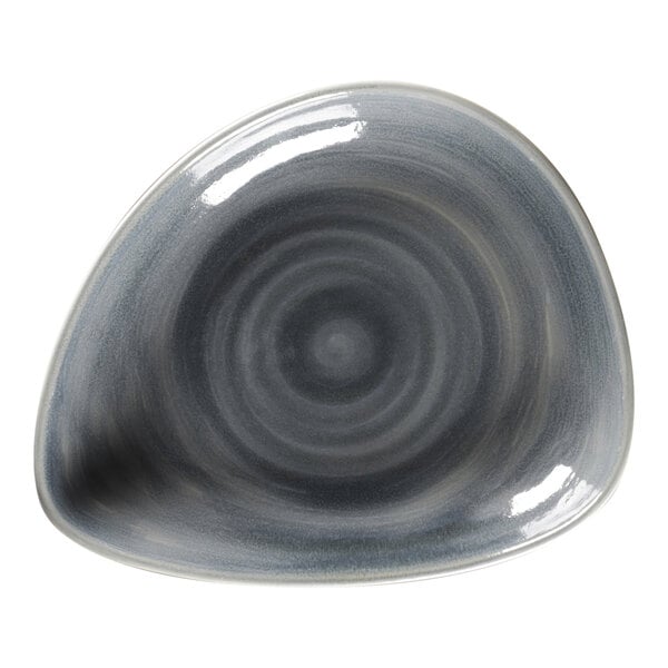 A grey RAK Porcelain triangle shaped plate with a circular spiral pattern in the middle.