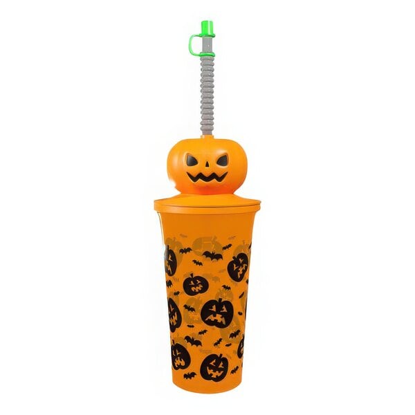 A yellow plastic souvenir cup with a straw and pumpkin pattern.