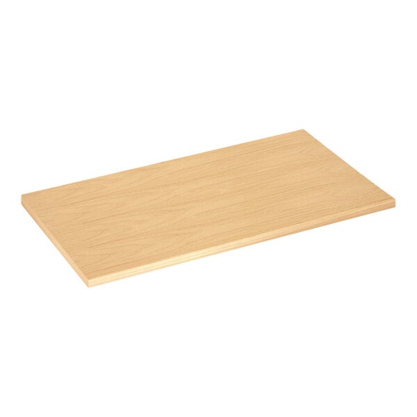 A Maple laminated wood merchandiser shelf on a wooden surface.