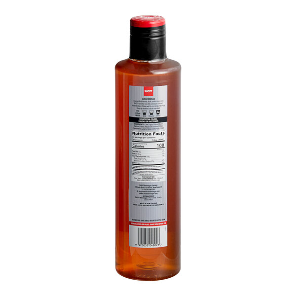 A close-up of a SHOTT Gingerbread Flavoring Syrup bottle with a label.