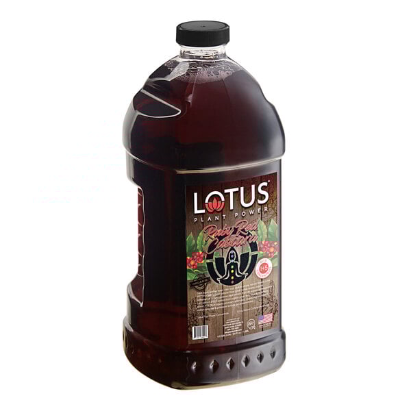 A large bottle of Lotus Plant Energy Ruby Red Cascara Concentrate with a label.