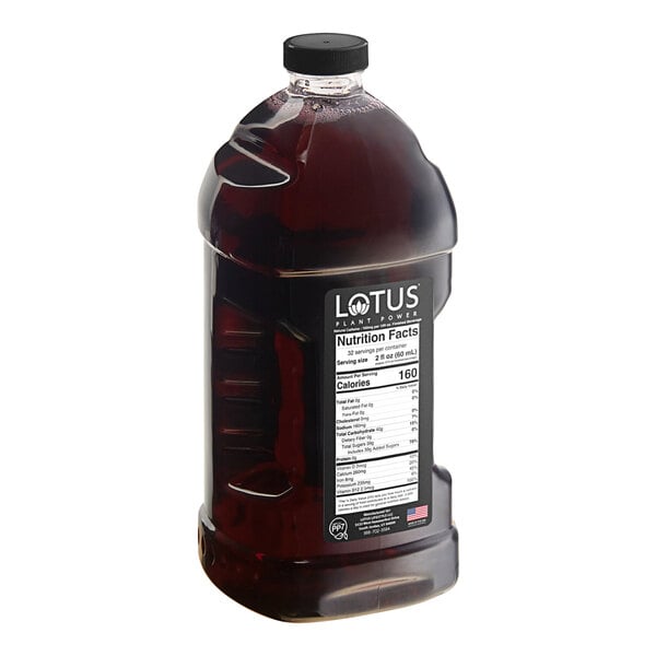 A bottle of Lotus Plant Energy Ruby Red Cascara concentrate with a label.