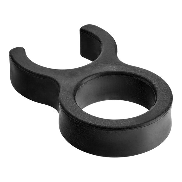 A black plastic clip with a circle on it.