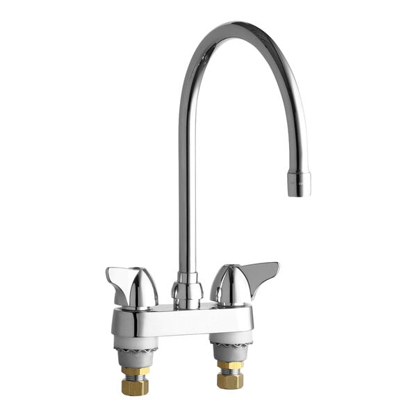 A chrome Chicago Faucets deck-mounted faucet with two handles and a gooseneck spout.