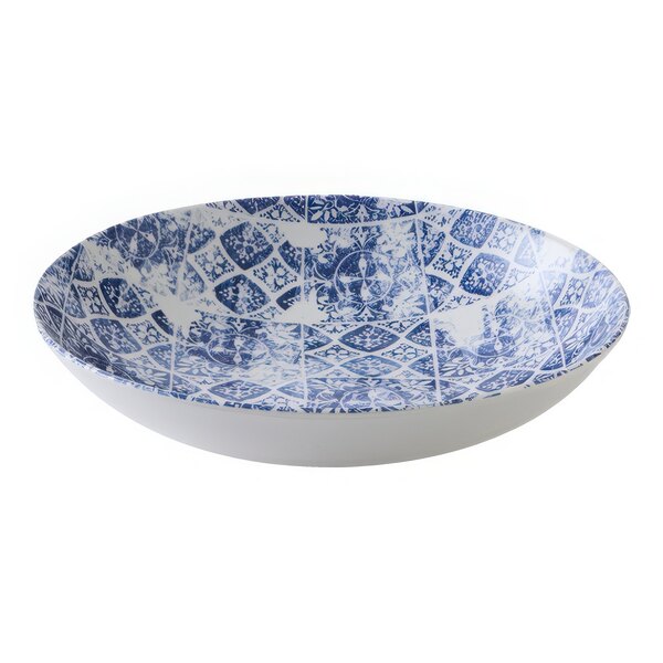 A white china coupe bowl with a blue pattern on it.