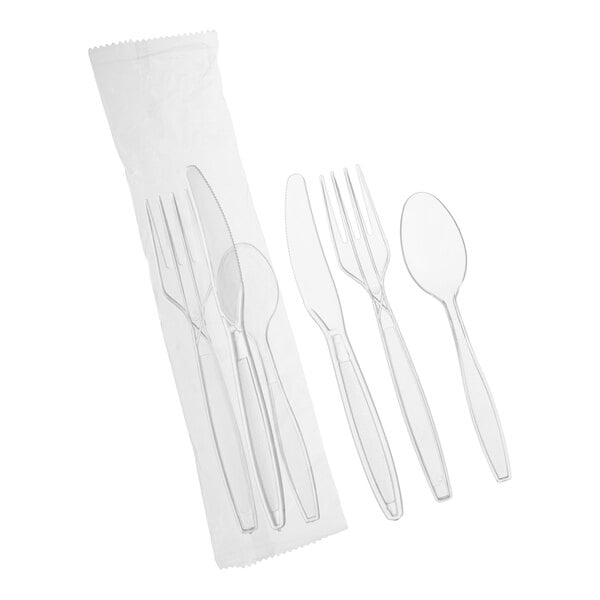 A set of clear heavy weight polystyrene plastic cutlery including a fork, knife, and spoon, individually wrapped in plastic.