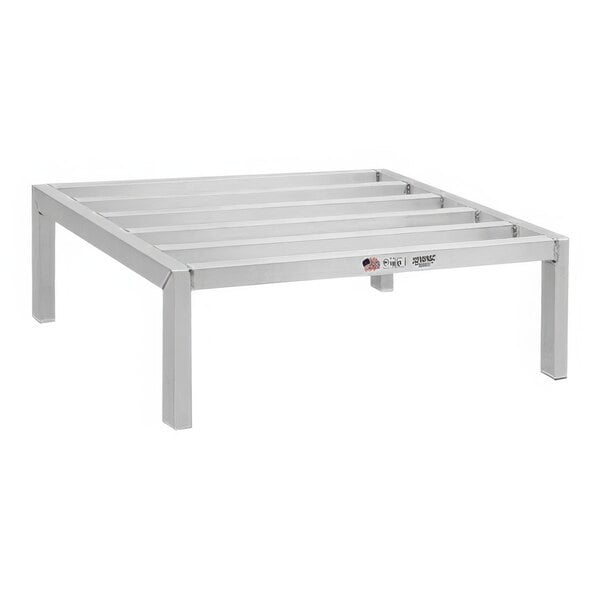 A New Age metal dunnage rack with metal slats.