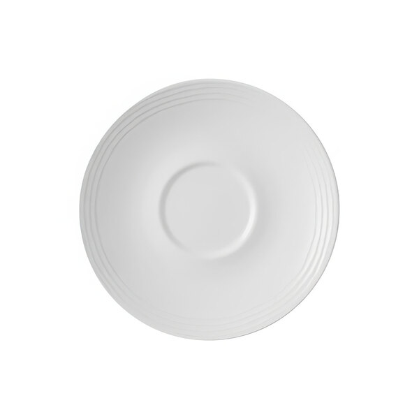 A white Dudson Harvest Norse saucer with a circular pattern on it.