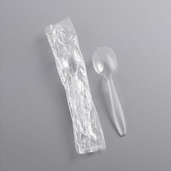 A clear plastic wrapped Choice soup spoon.