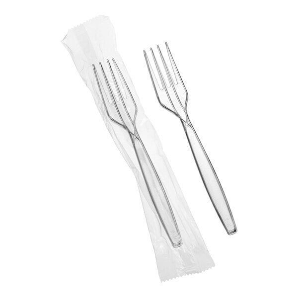 A set of clear heavy weight polystyrene plastic forks, with one fork individually wrapped in plastic.