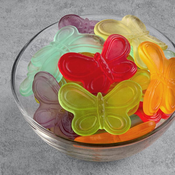 A bowl of colorful candy butterflies.