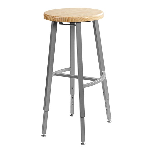 A National Public Seating Titan lab stool with a wooden seat and metal legs.