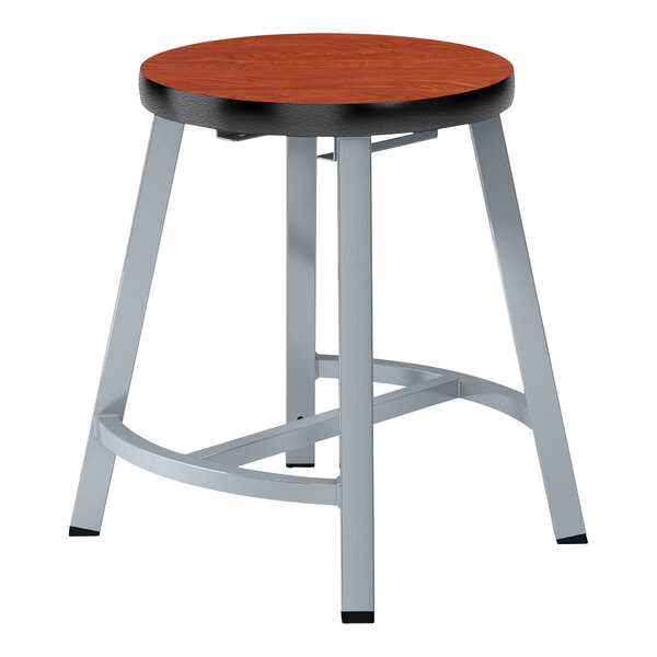 A National Public Seating Titan lab stool with a wooden seat and metal legs.