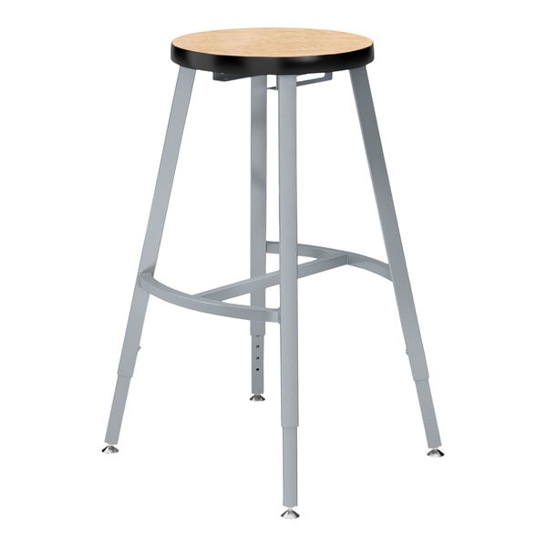 A National Public Seating Titan lab stool with a Fusion Maple high-pressure laminate seat.