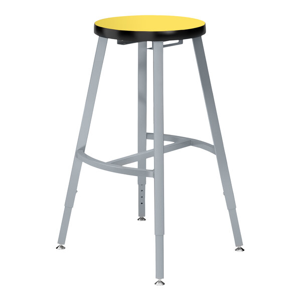 A National Public Seating Titan lab stool with a yellow high-pressure laminate seat.