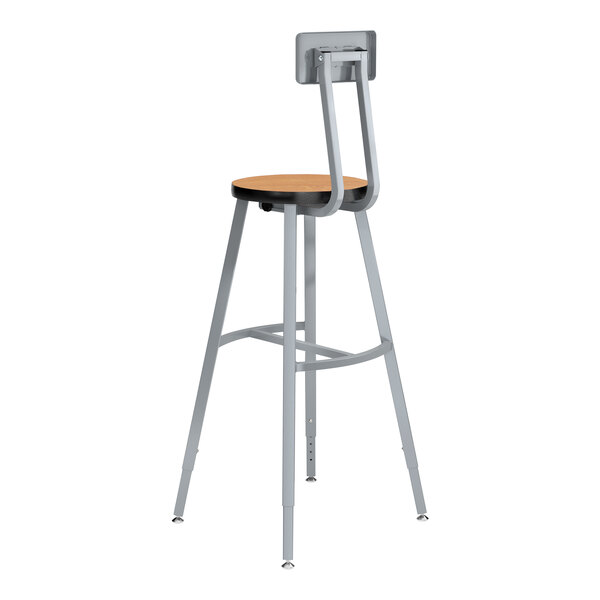 A National Public Seating Titan lab stool with a metal frame and a Bannister Oak high-pressure laminate seat.