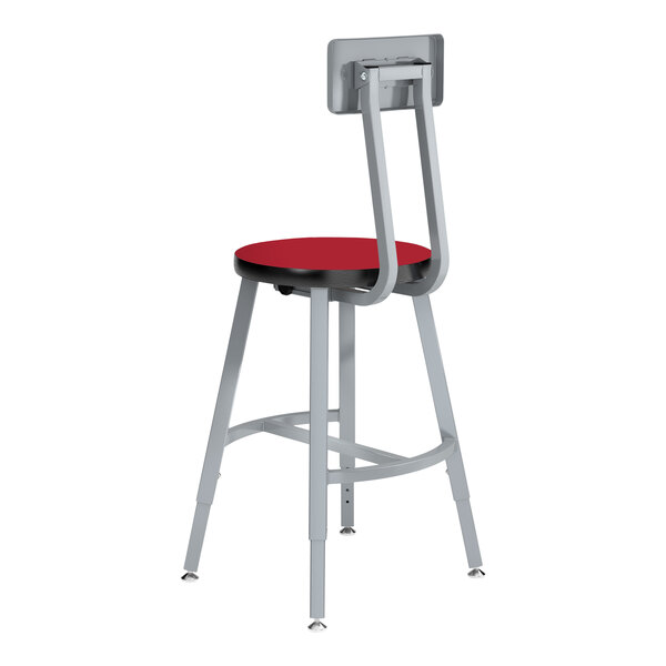 A National Public Seating gray lab stool with a metal frame and a red high-pressure laminate seat.