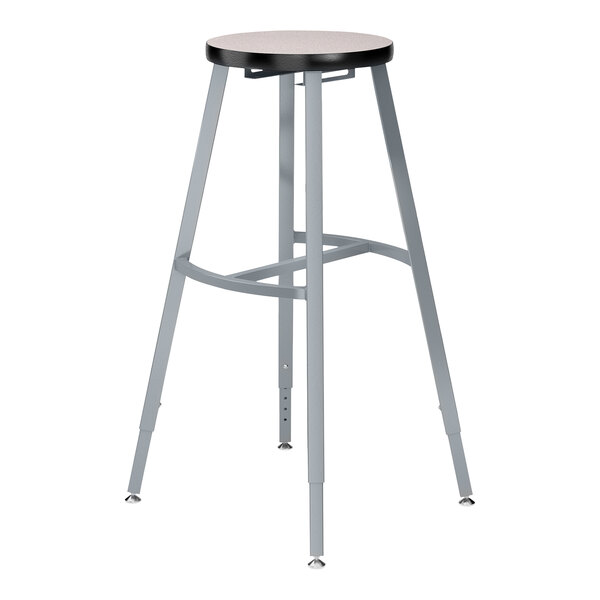 A National Public Seating Titan lab stool with a gray high-pressure laminate seat and steel legs.